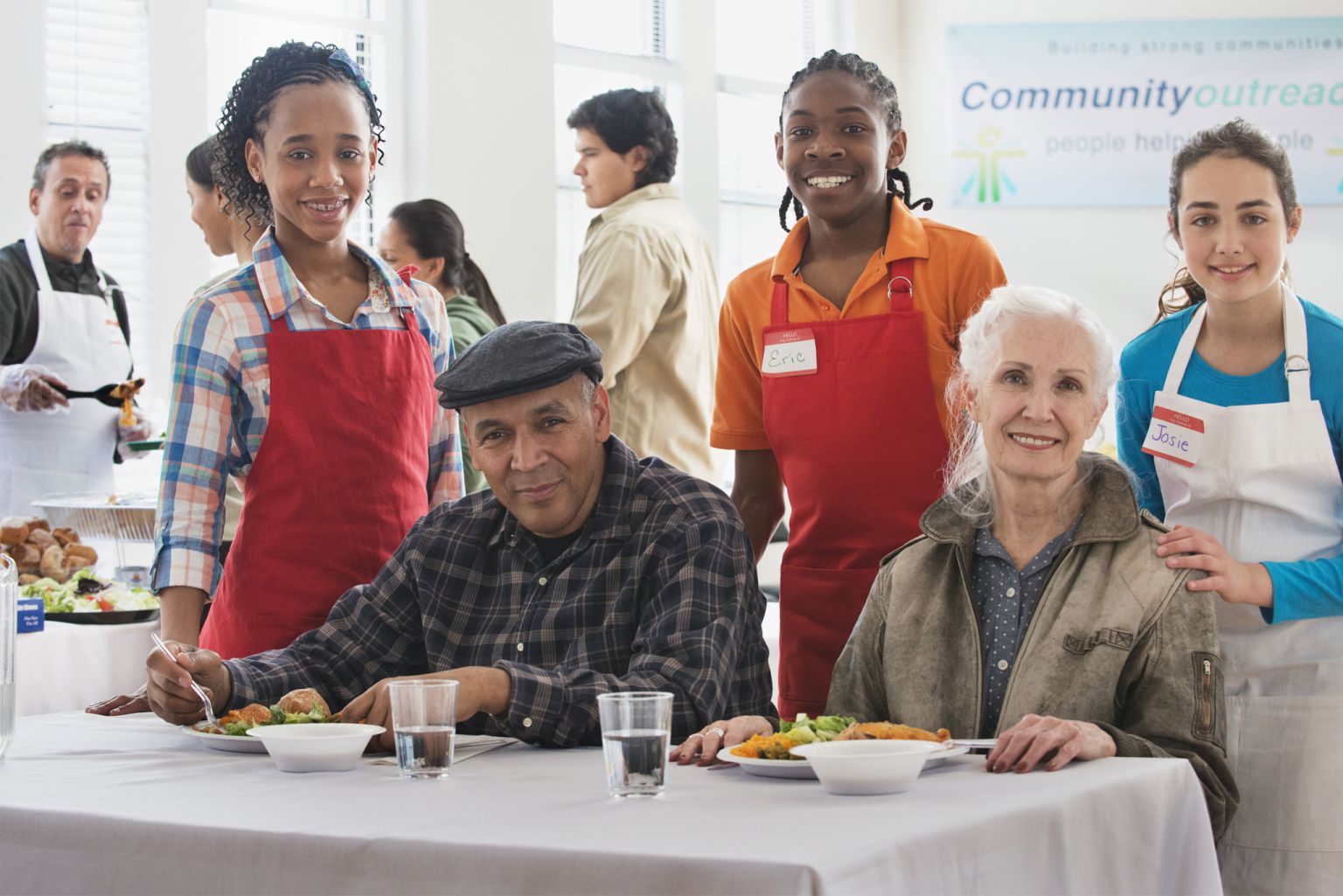 Volunteers serving food at community kitchen
